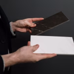 white and black marble tiles in hands
